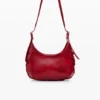 Kleine glänzende Tasche mit Blumen-Applikationen