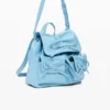 Kleiner glänzender Rucksack mit Schleife Kleiner glänzender Rucksack mit Schleife