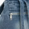 Kleiner Rucksack aus Denim mit Anhängern