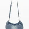 Mittlere ovale Tasche mit Anhängern Mittlere ovale Tasche mit Anhängern