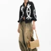 Mittlere Raffia-Tasche mit Anhängern Mittlere Raffia-Tasche mit Anhängern