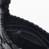 Tasche aus Kunstleder mit Nieten